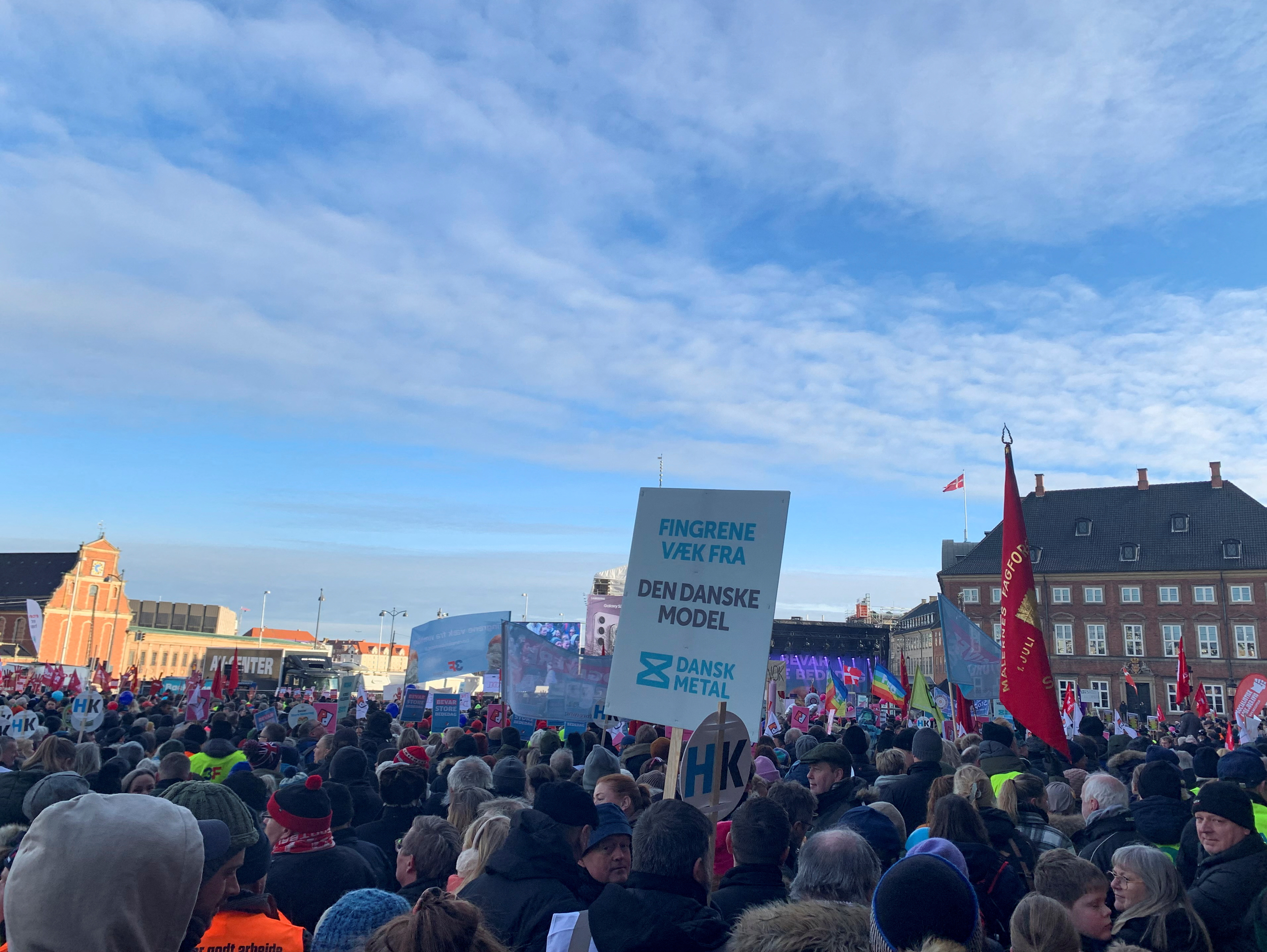 People take part in a protest outside of Danish Parliament building in Copenhagen