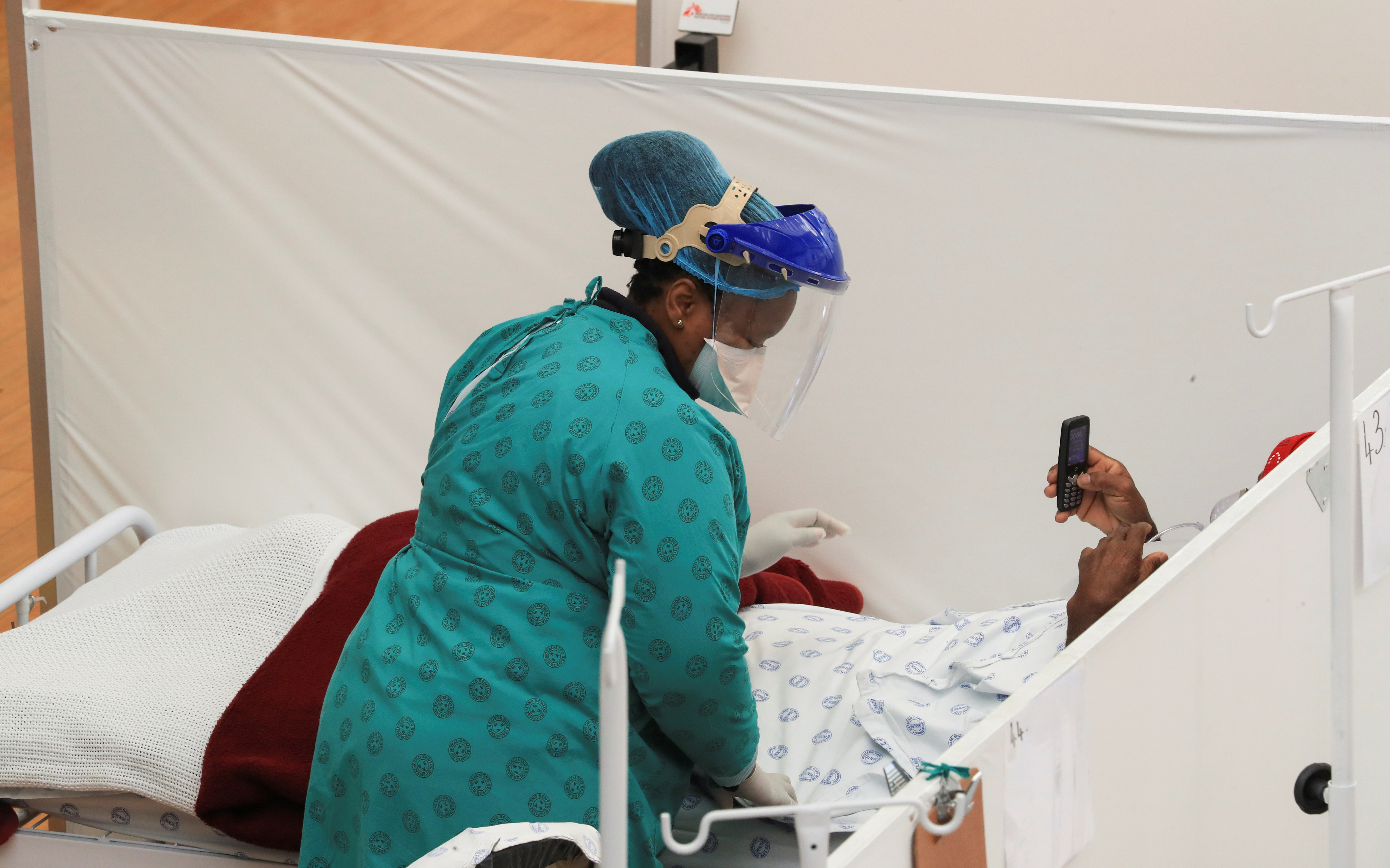 South Africa experiencing a new COVID-19 strain - health minister | Reuters