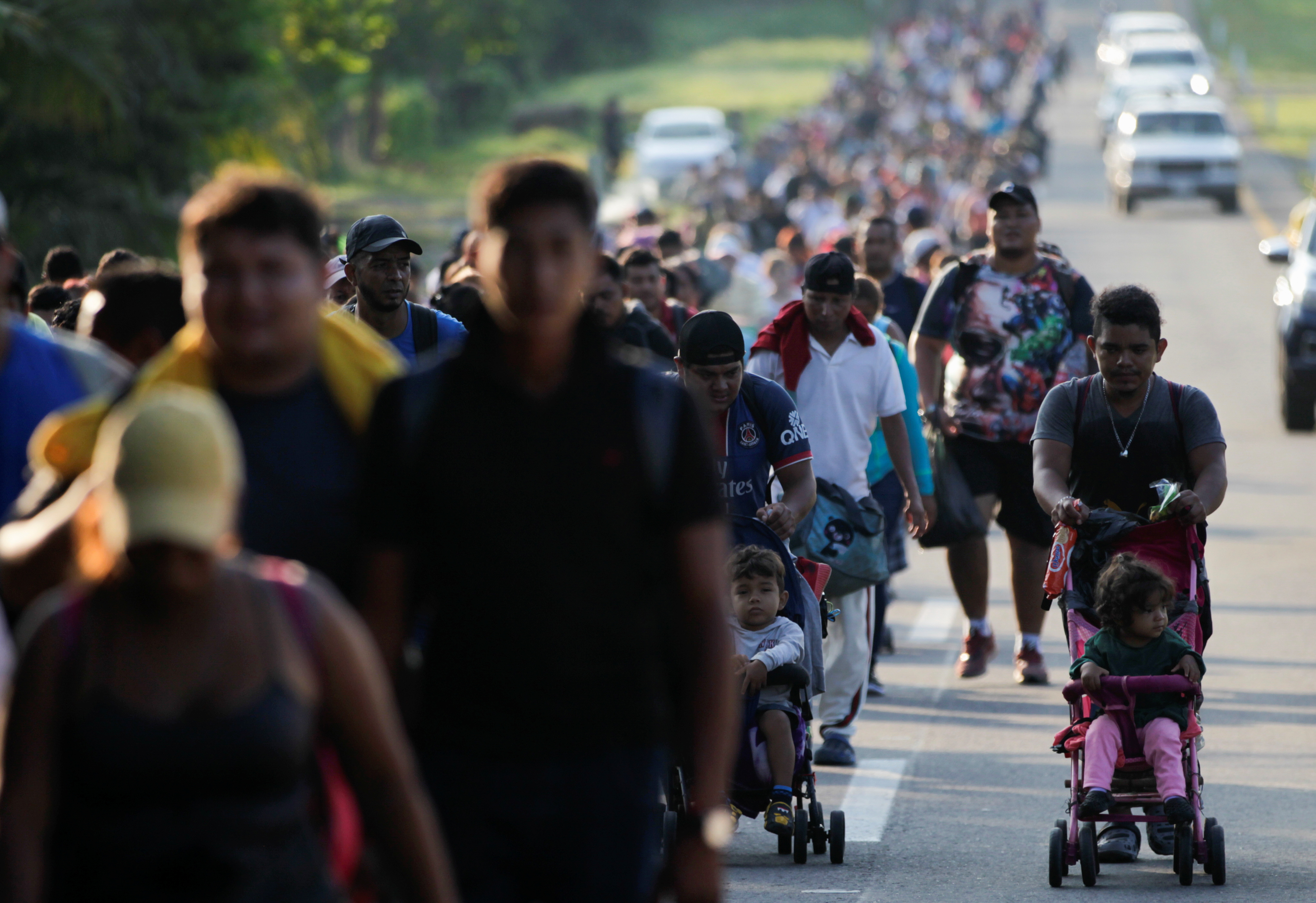 Migrants continue walking as they take part in a caravan heading to Mexico City, in Ernestina de Montes, Mexico November 1, 2021. REUTERS/Daniel Becerril