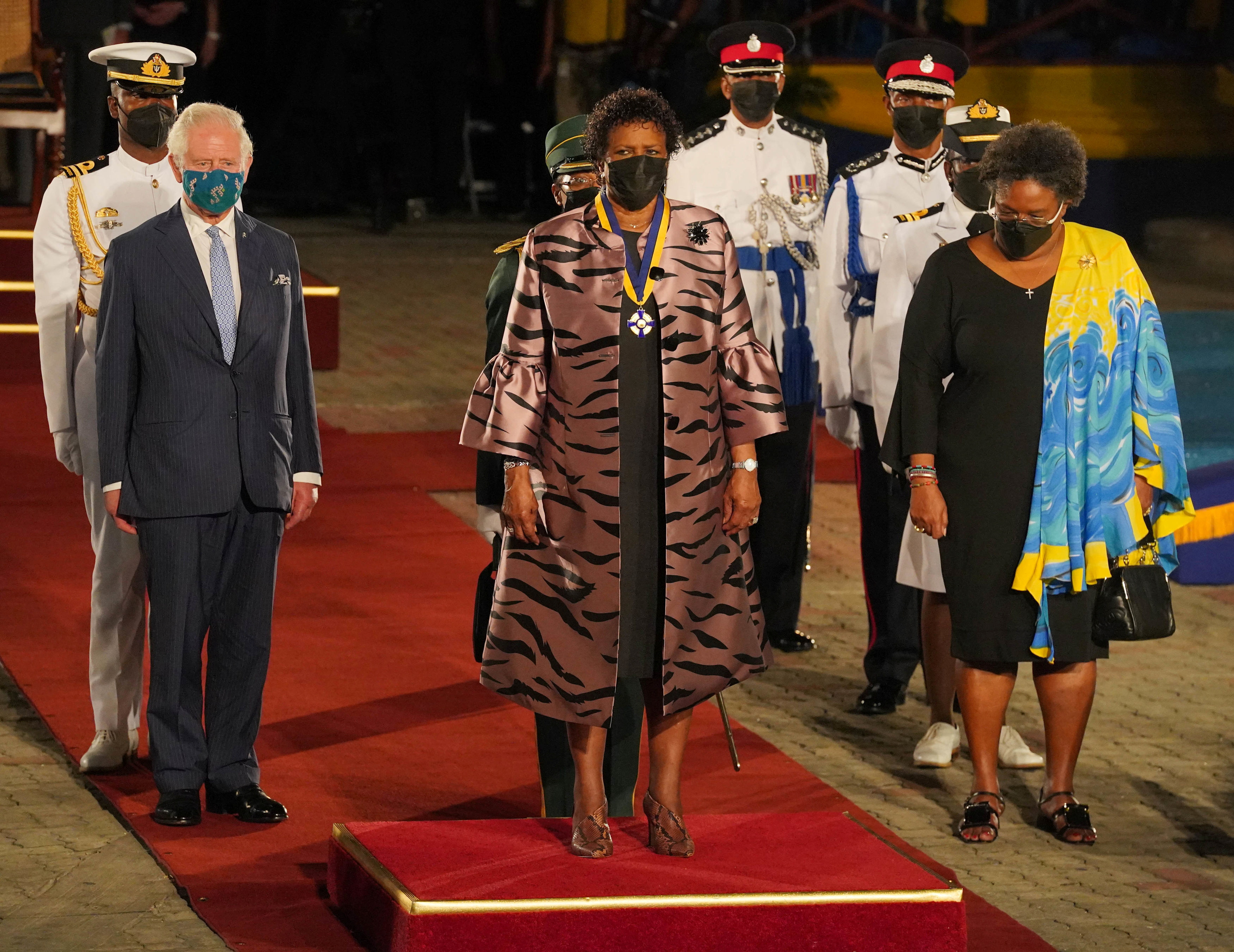 Britain's Prince Charles is joined by Barbados President Sandra Mason and Barbados Prime Minister Mia Mottley as they prepare to depart from the Presidential Inauguration Ceremony, held to mark the birth of a new republic in Barbados at Heroes Square in Bridgetown, Barbados, November 30, 2021. Jonathan Brady/Pool via REUTERS