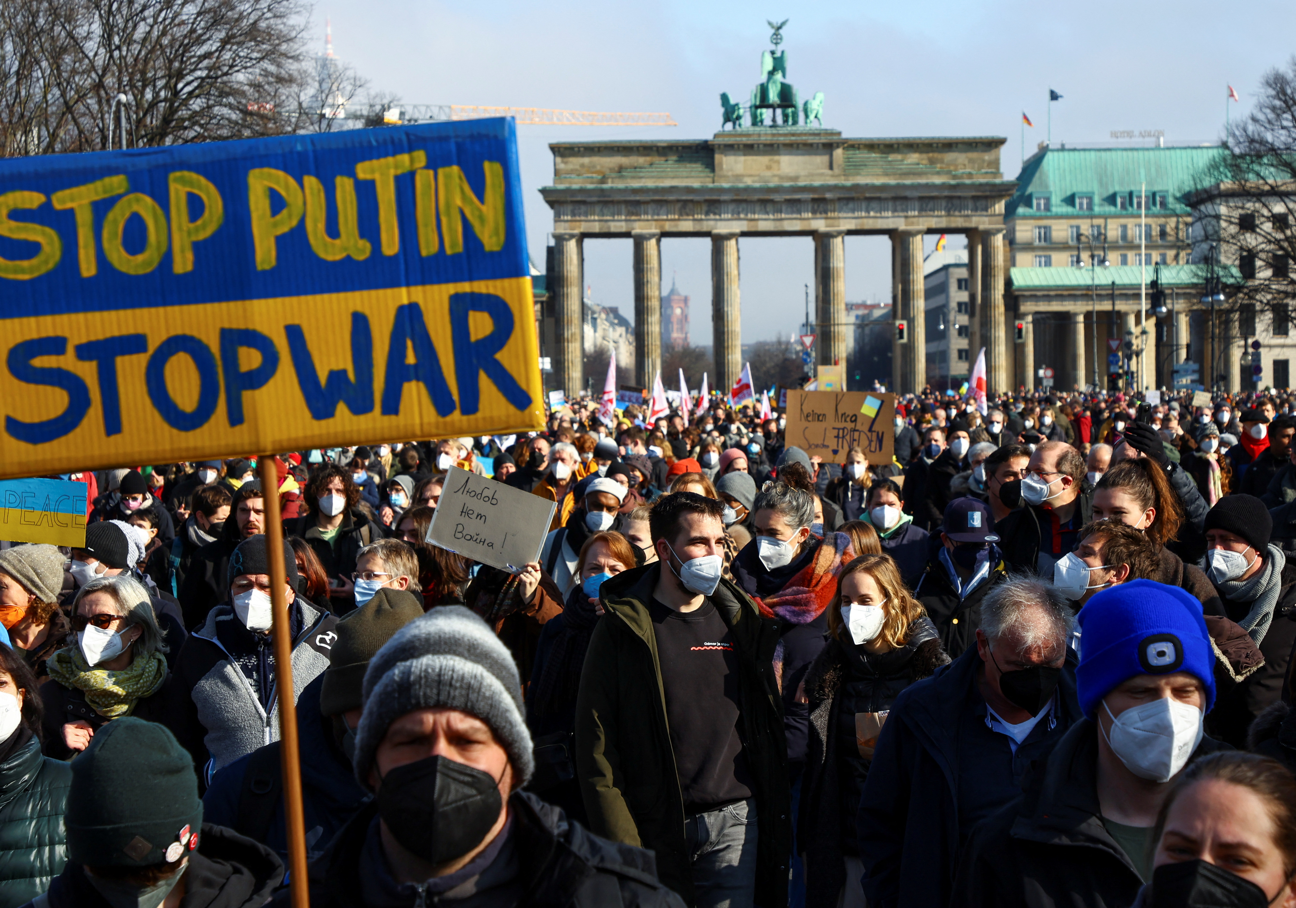 Demonstrators march during an anti-war protest, after Russia launched a massive military operation against Ukraine, outside the Brandenburg Gate in Berlin, Germany, February 27, 2022. REUTERS/Fabrizio Bensch