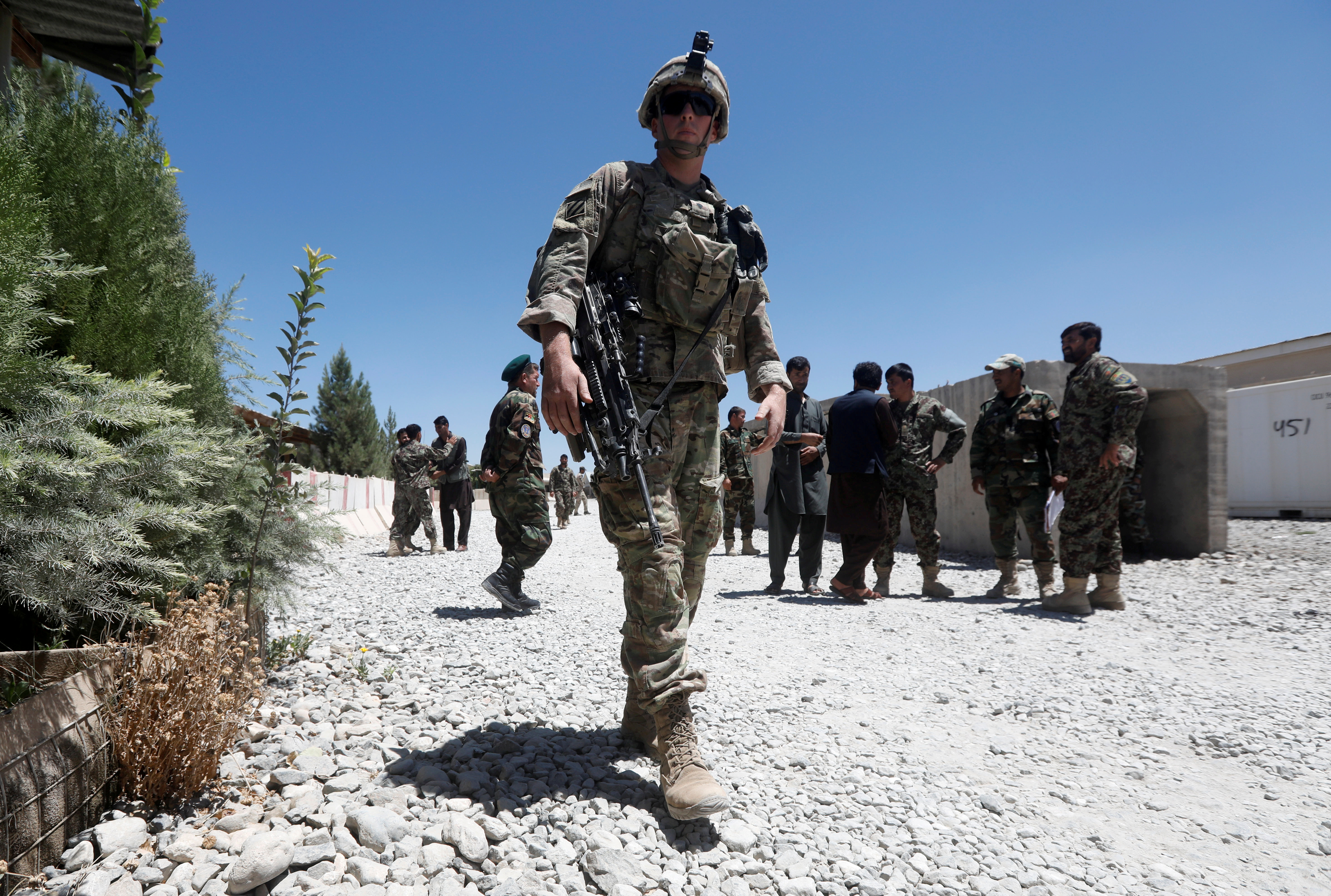 An U.S. soldier keeps watch at an Afghan National Army (ANA) base in Logar province, Afghanistan