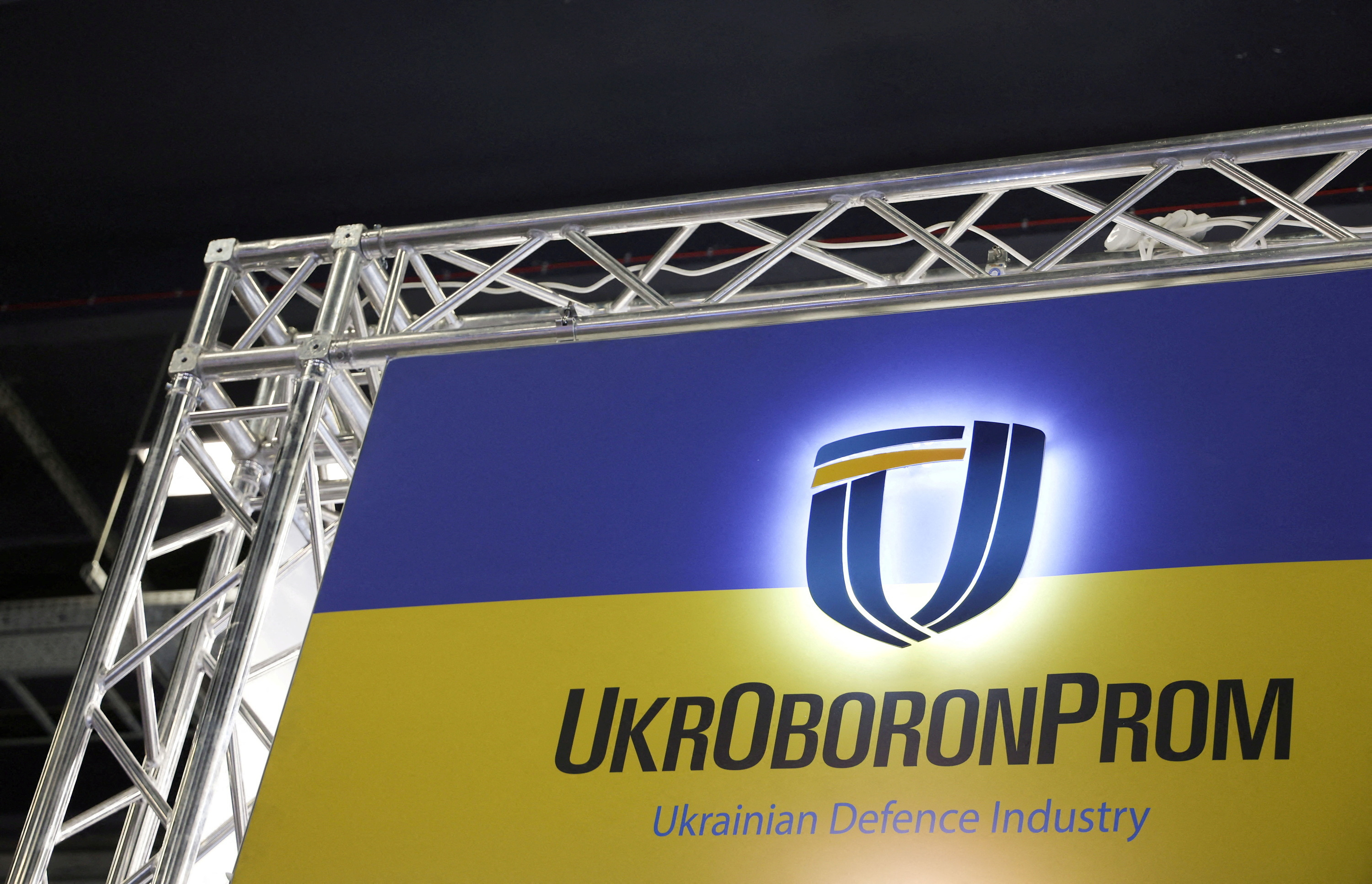 Ukrainian UkrOboronProm logo is pictured at their stand inside a hall of the 30th International Defence Industry Exhibition in Kielce