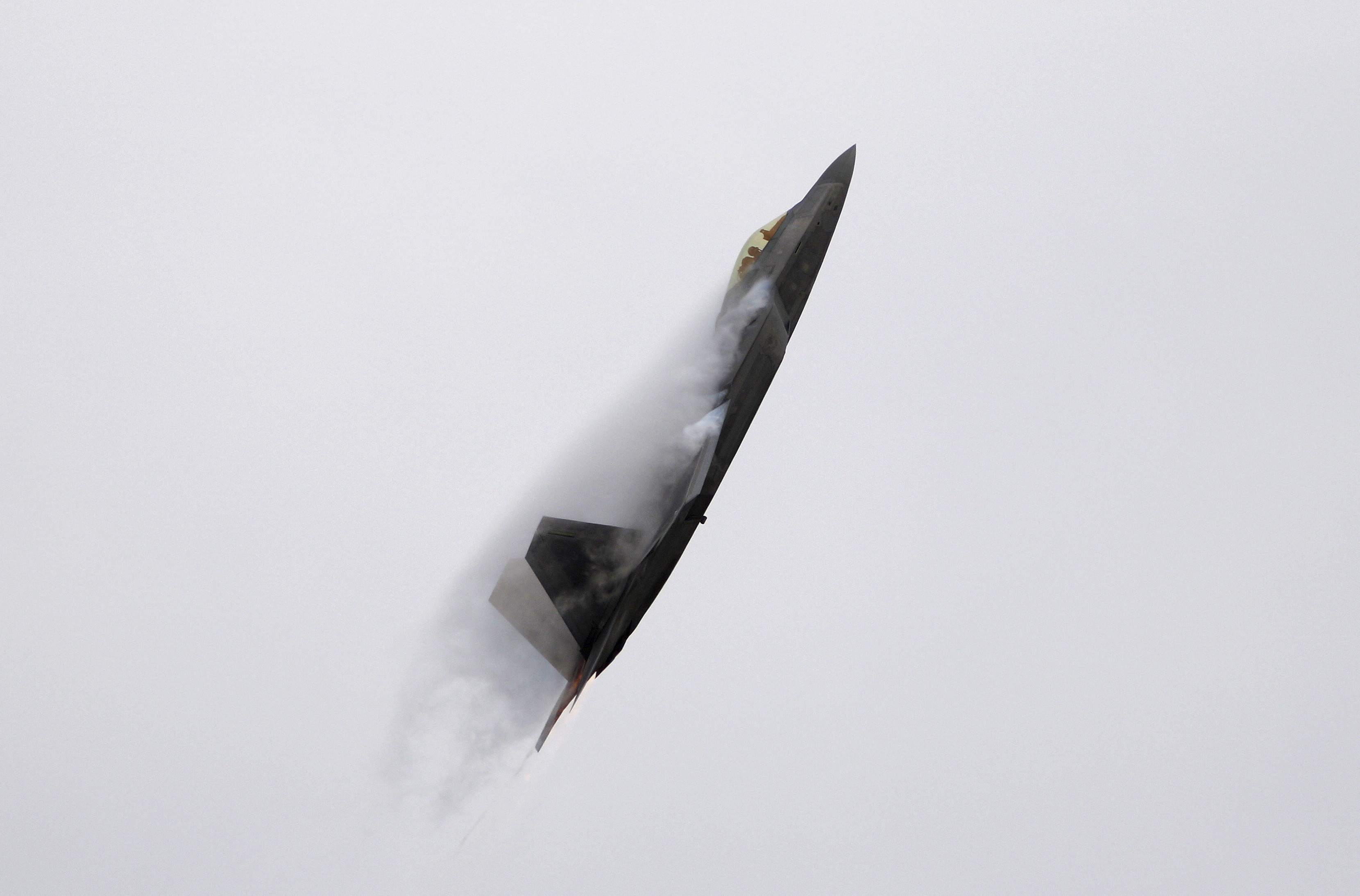 An F-22 Raptor fighter jet performs maneuvers during the California International Airshow in Salinas