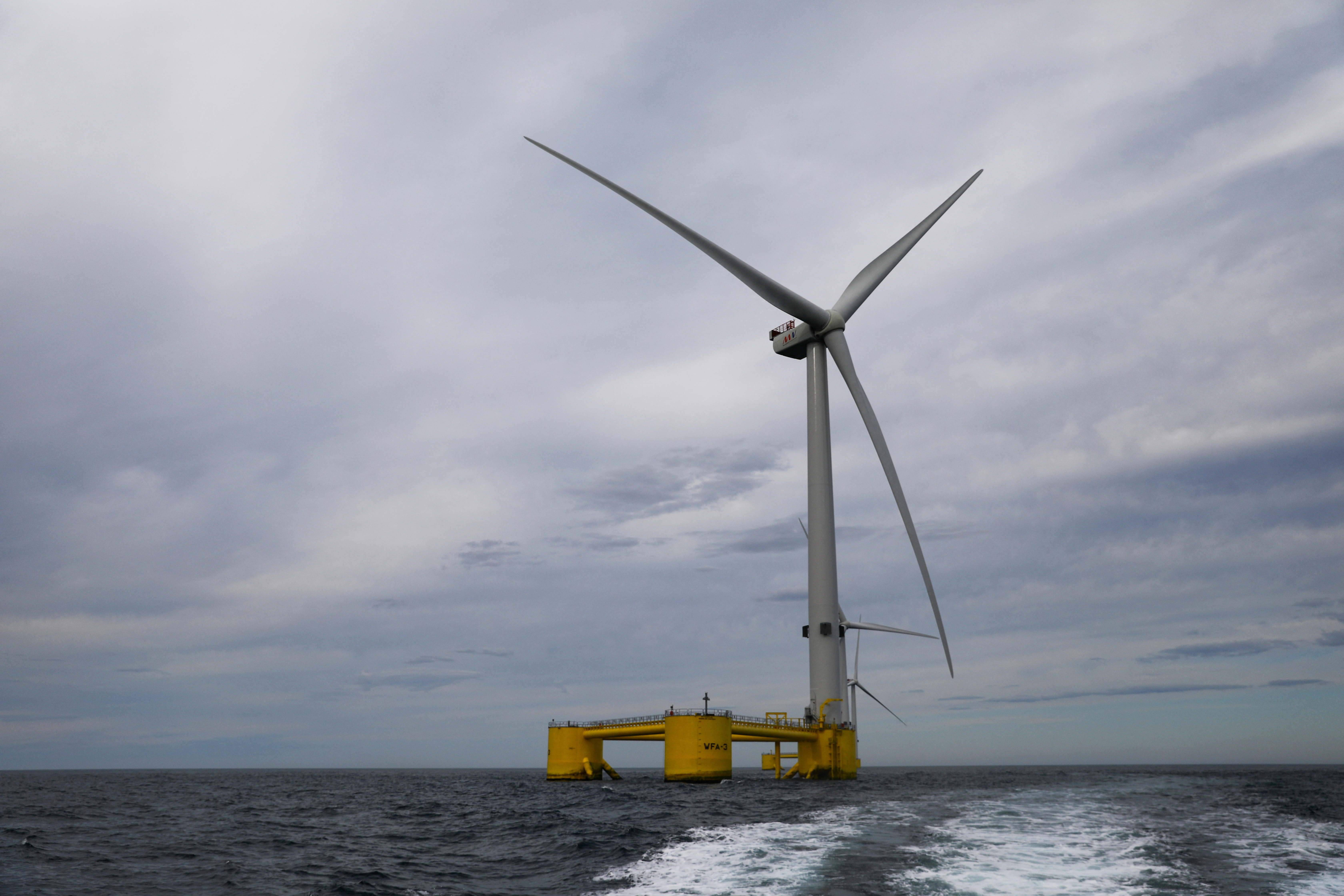 Turbines of the WindFloat Atlantic Project, a floating offshore wind-power generating platform, are seen 20 kilometers off the coast in Viana do Castelo