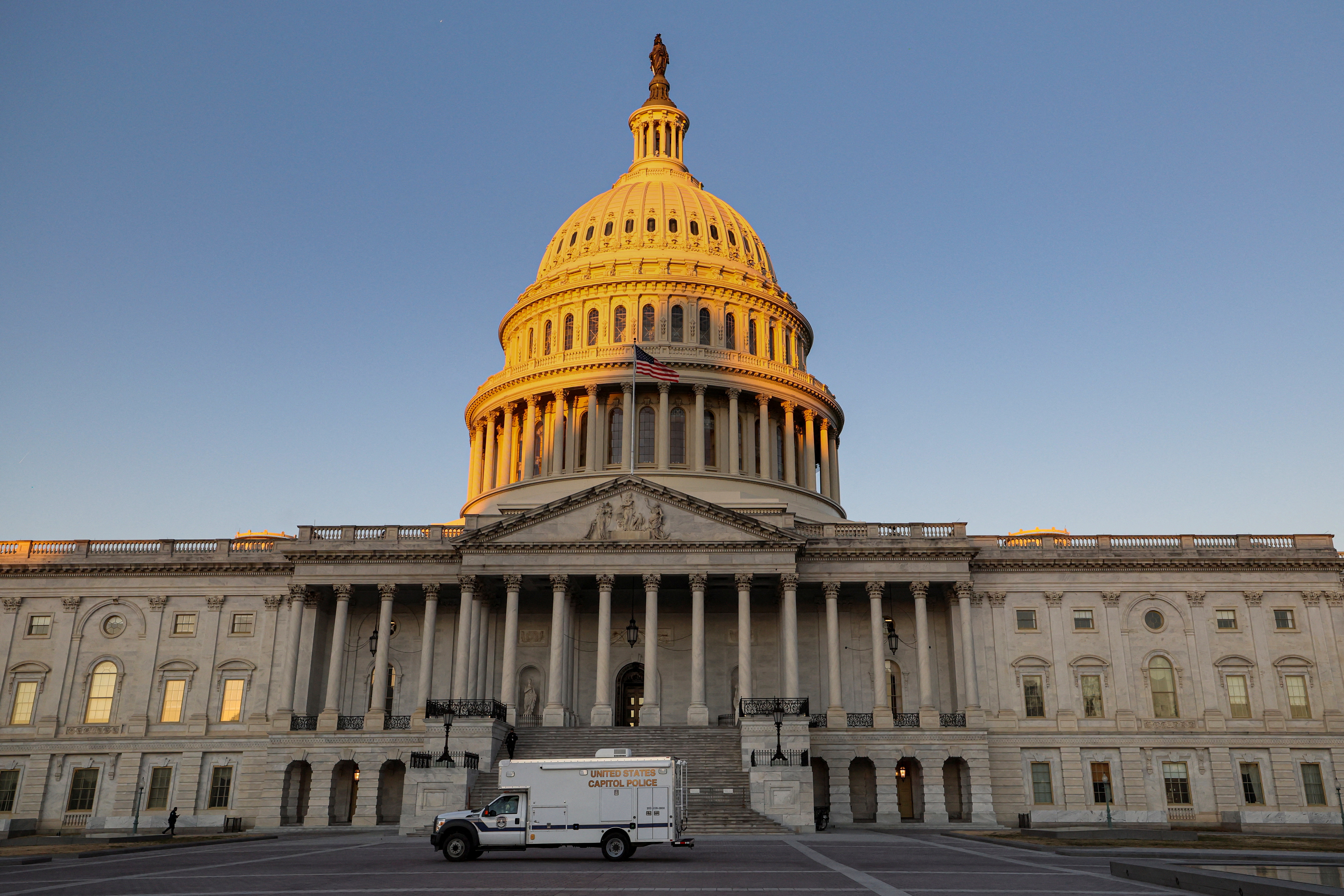A U.S. Capitol Police truck passes by the front of the U.S. Capitol building during morning hours in Washington