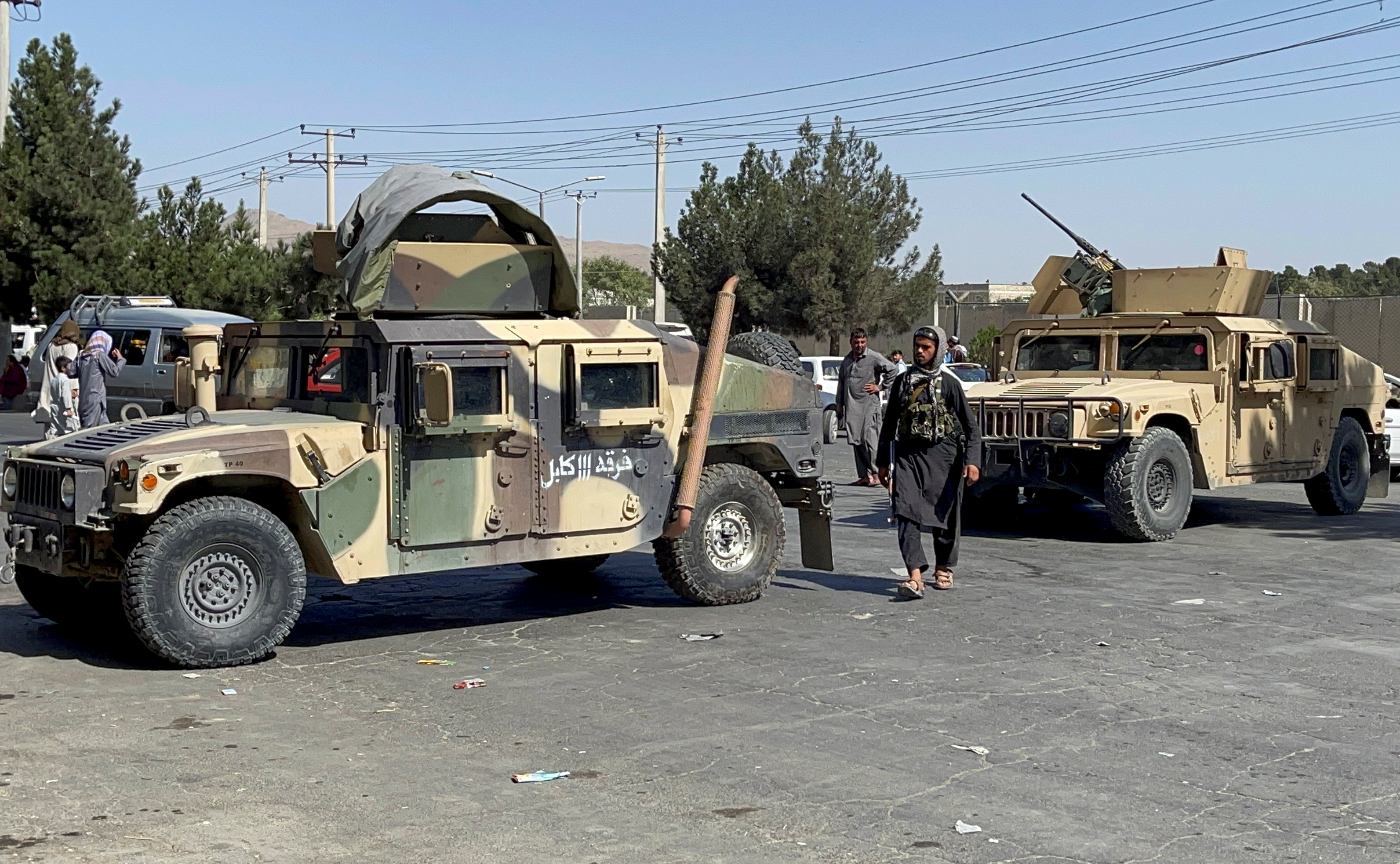 Taliban forces block the roads around the airport in Kabul