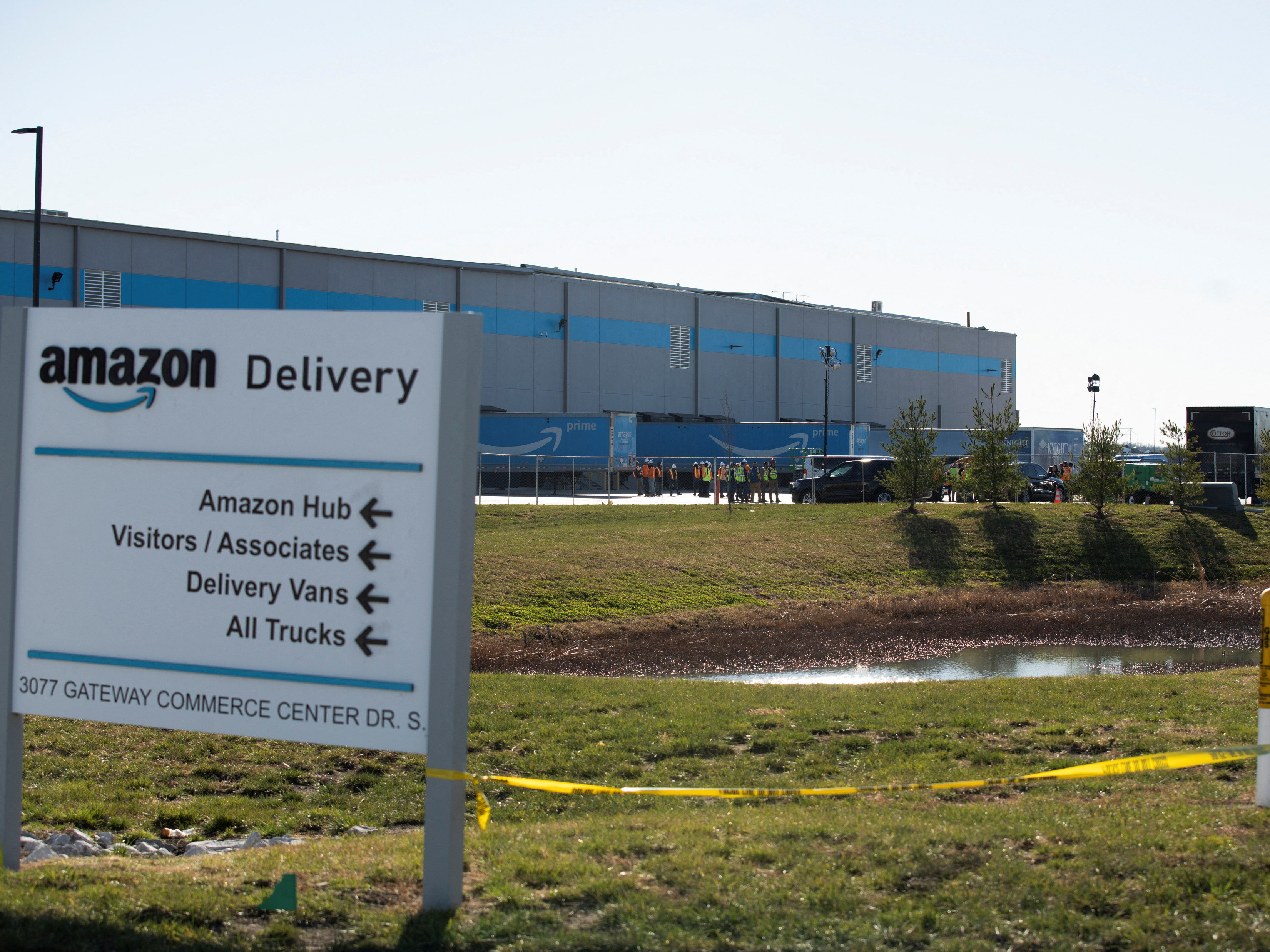 Emergency vehicles surround the site of a roof collapse at an Amazon distribution center in Edwardsville