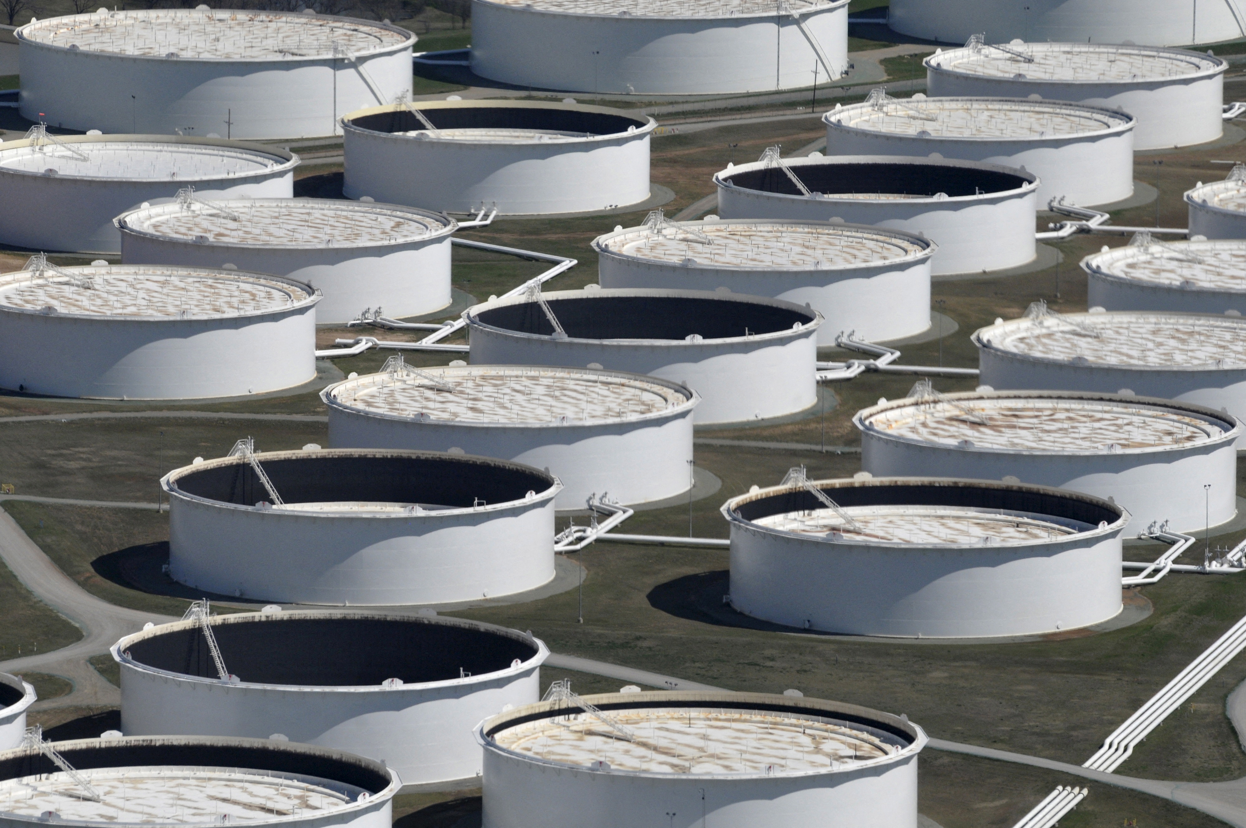 U.S. crude stockpiles rise despite Cushing draw, record fuel demand - EIA | Reuters