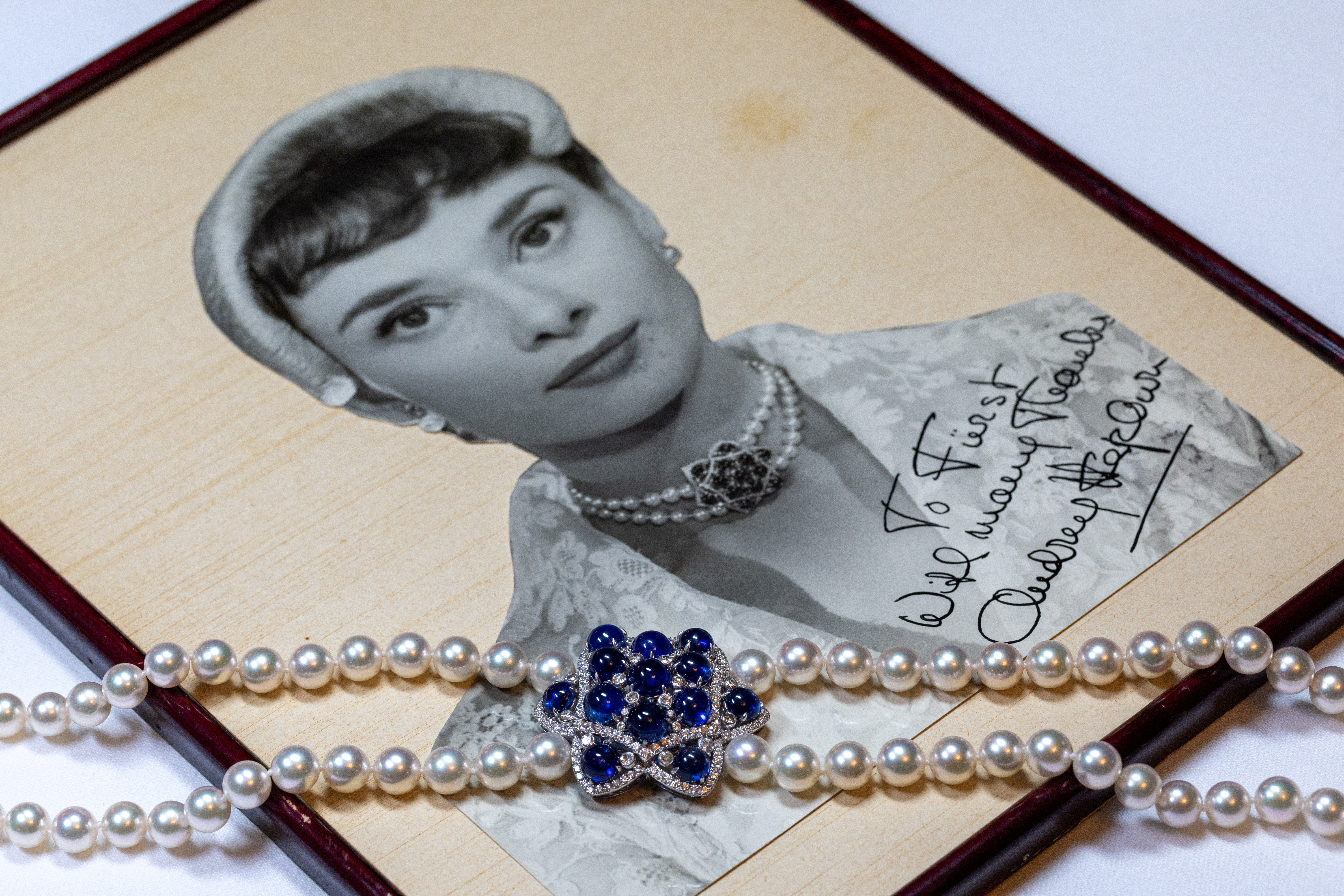 A pearl necklace worn by Audrey Hepburn in the final scene of the movie "Roman Holiday" is seen at Christie’s in Geneva