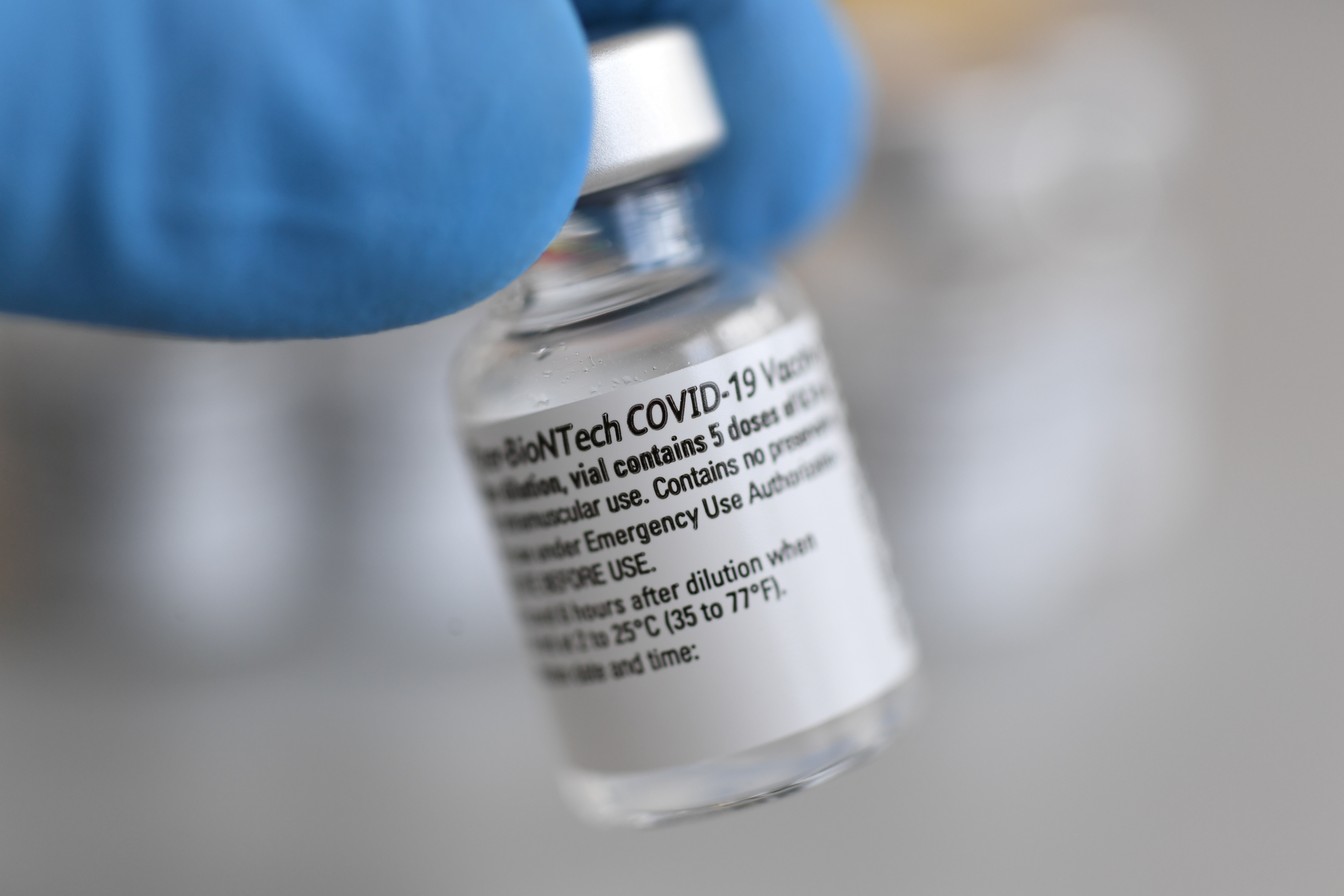 A vial containing doses of the Pfizer-BioNTech COVID-19 vaccine is seen at the Bavarian Red Cross vaccination center, in Pfaffenhofen an der Ilm