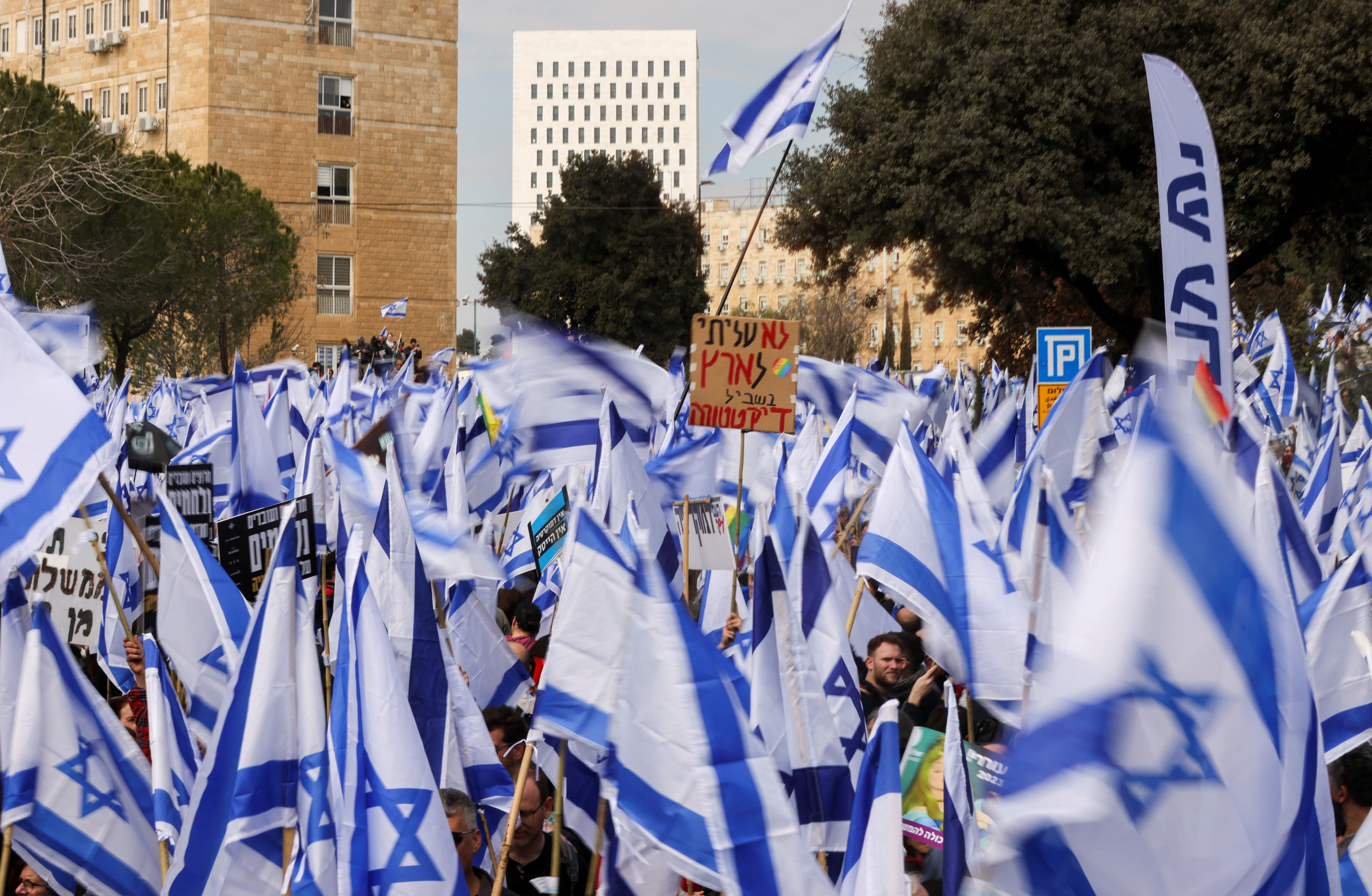 Israelis demonstrate on the day Israel's constitution committee is set to vote on judicial plan, in Jerusalem