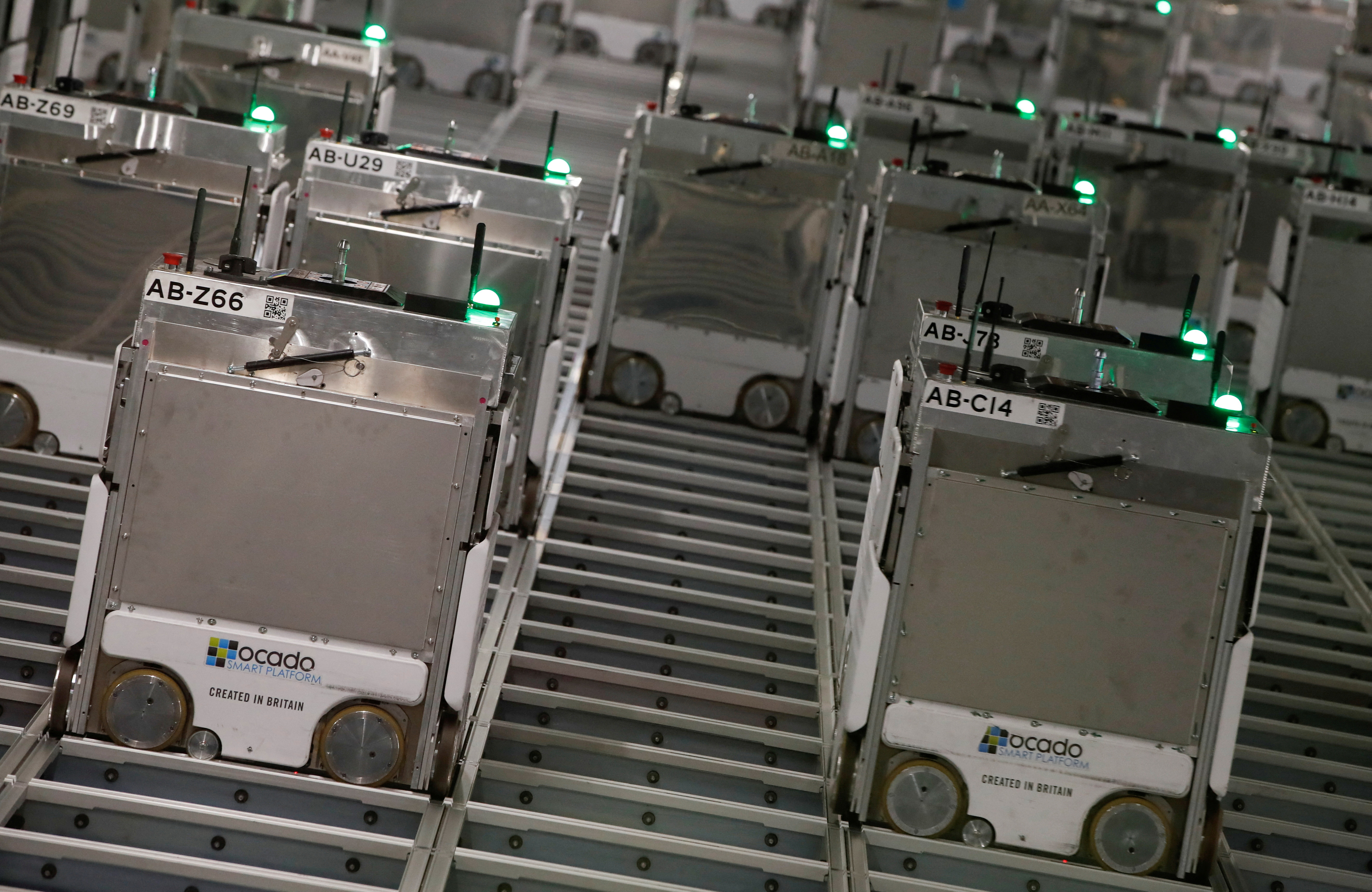 Ocado robots are seen inside a warehouse in Erith