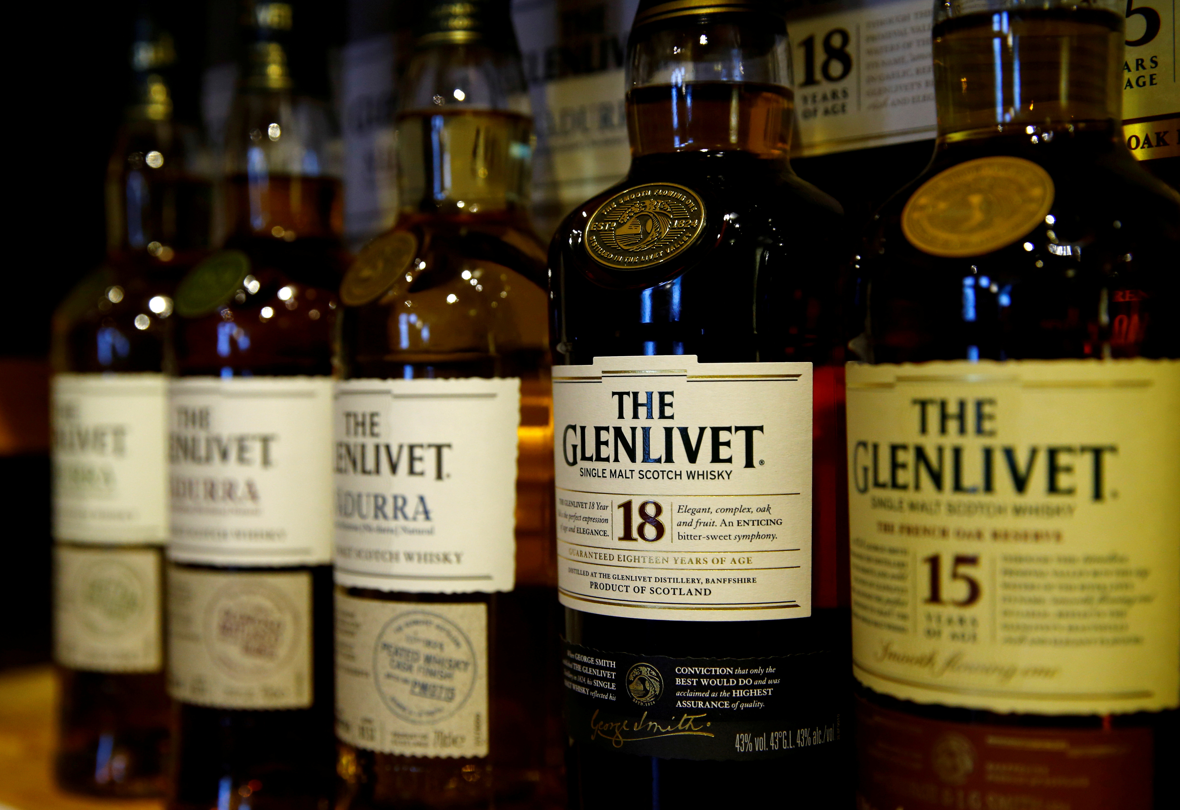 Bottles of single malt scotch whisky The Glenlivet, part of the Pernod Ricard group, are pictured in a shop near Lausanne