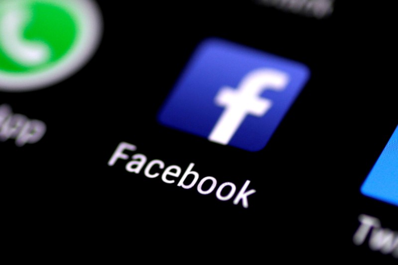 The Facebook app is seen on a phone screen