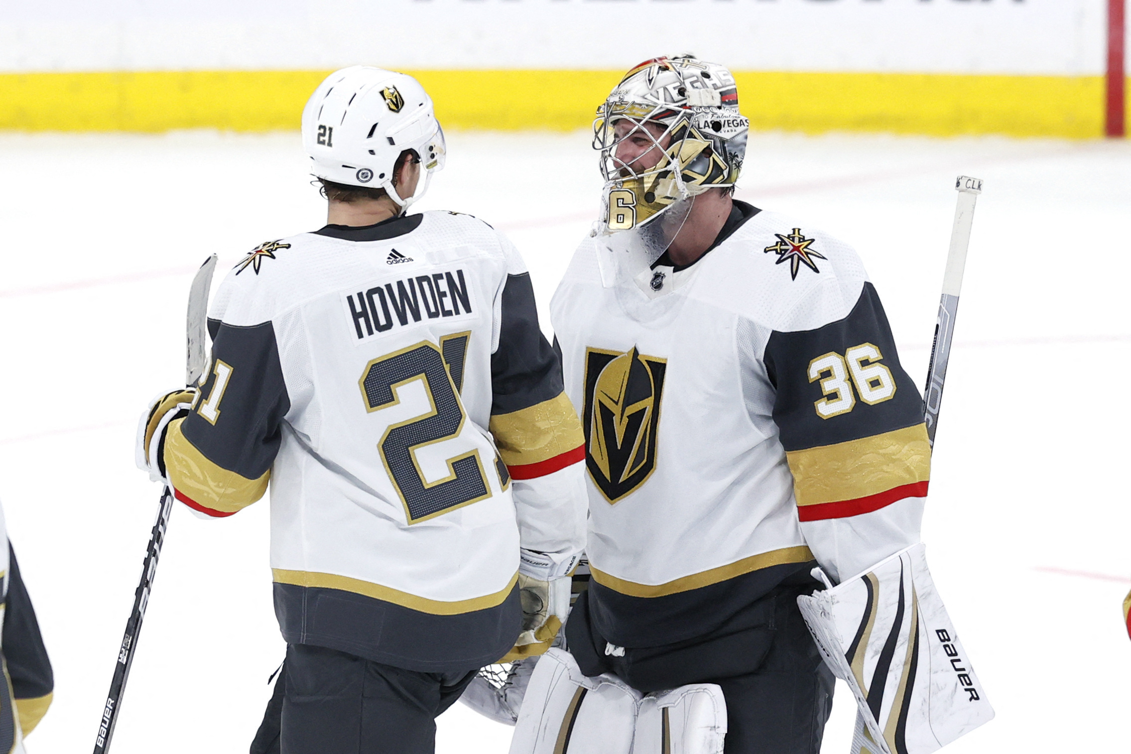 Vegas Golden Knights' Alec Martinez (23) saves a shot in front of  goaltender Laurent Brossoit (39) during the second period of Game 3 of an  NHL hockey Stanley Cup first-round playoff series