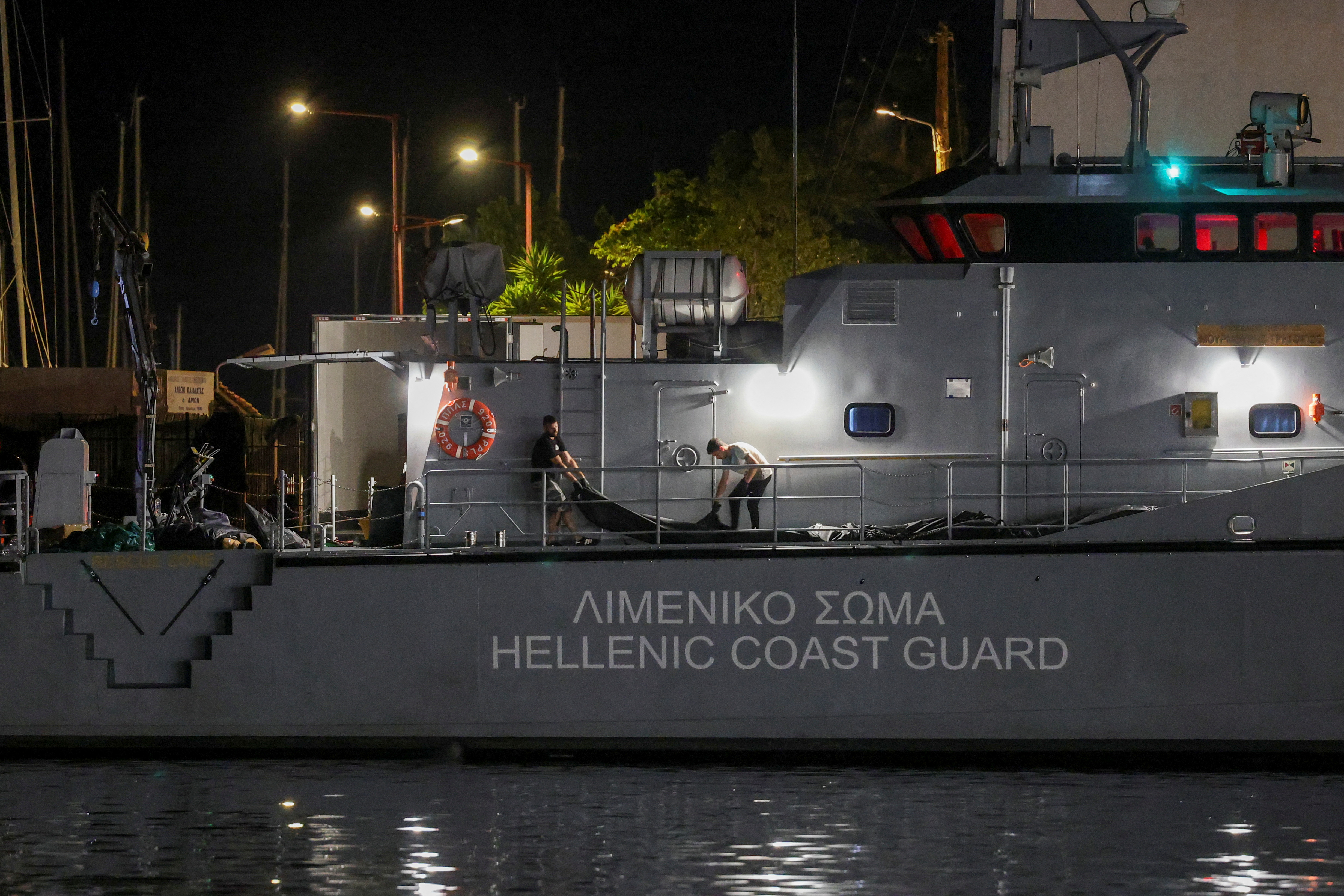 Body bags carrying migrants retrieved from sea arrive in Kalamata
