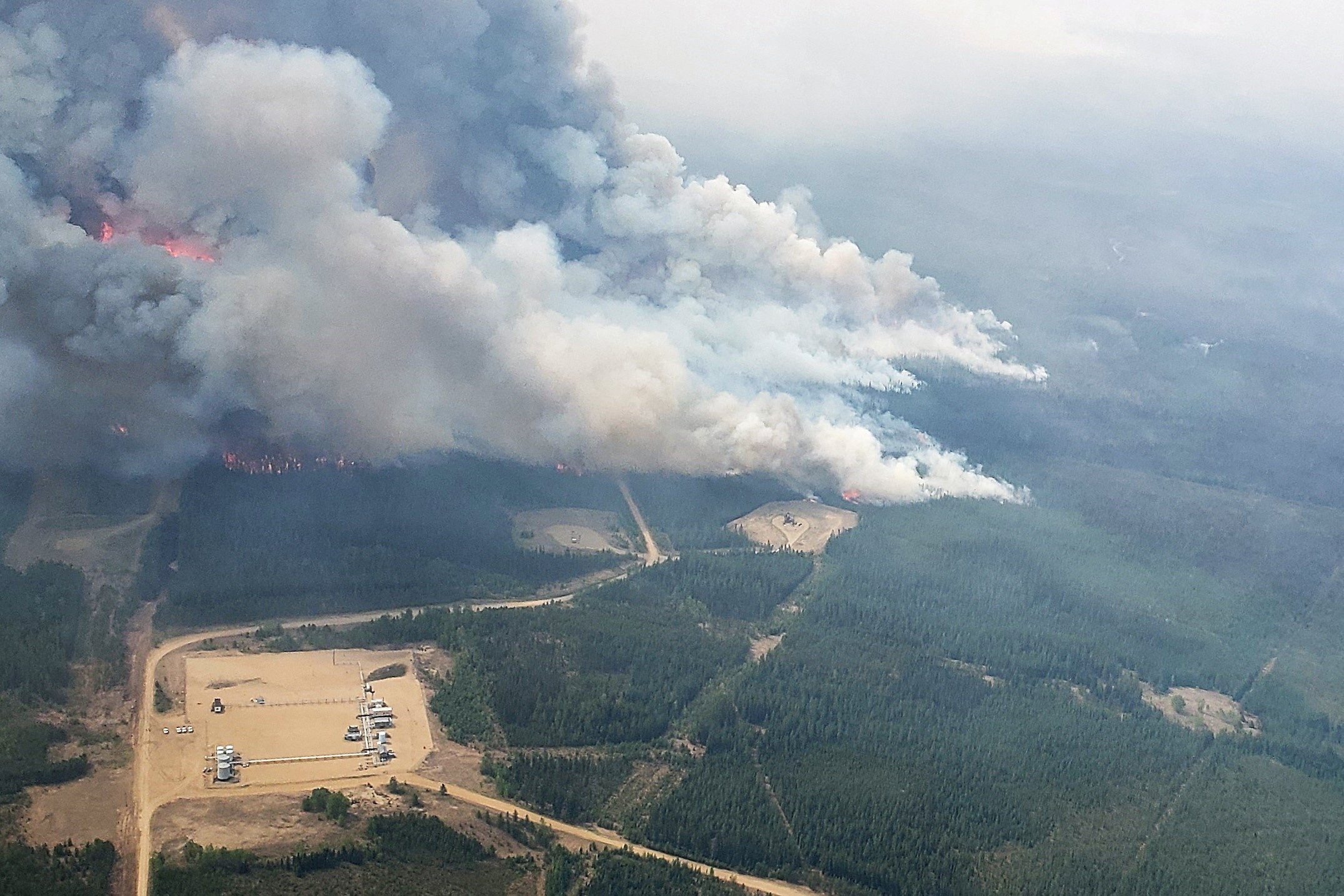 Smoke rises from areas of wildfire EWF-035 near Shining Bank