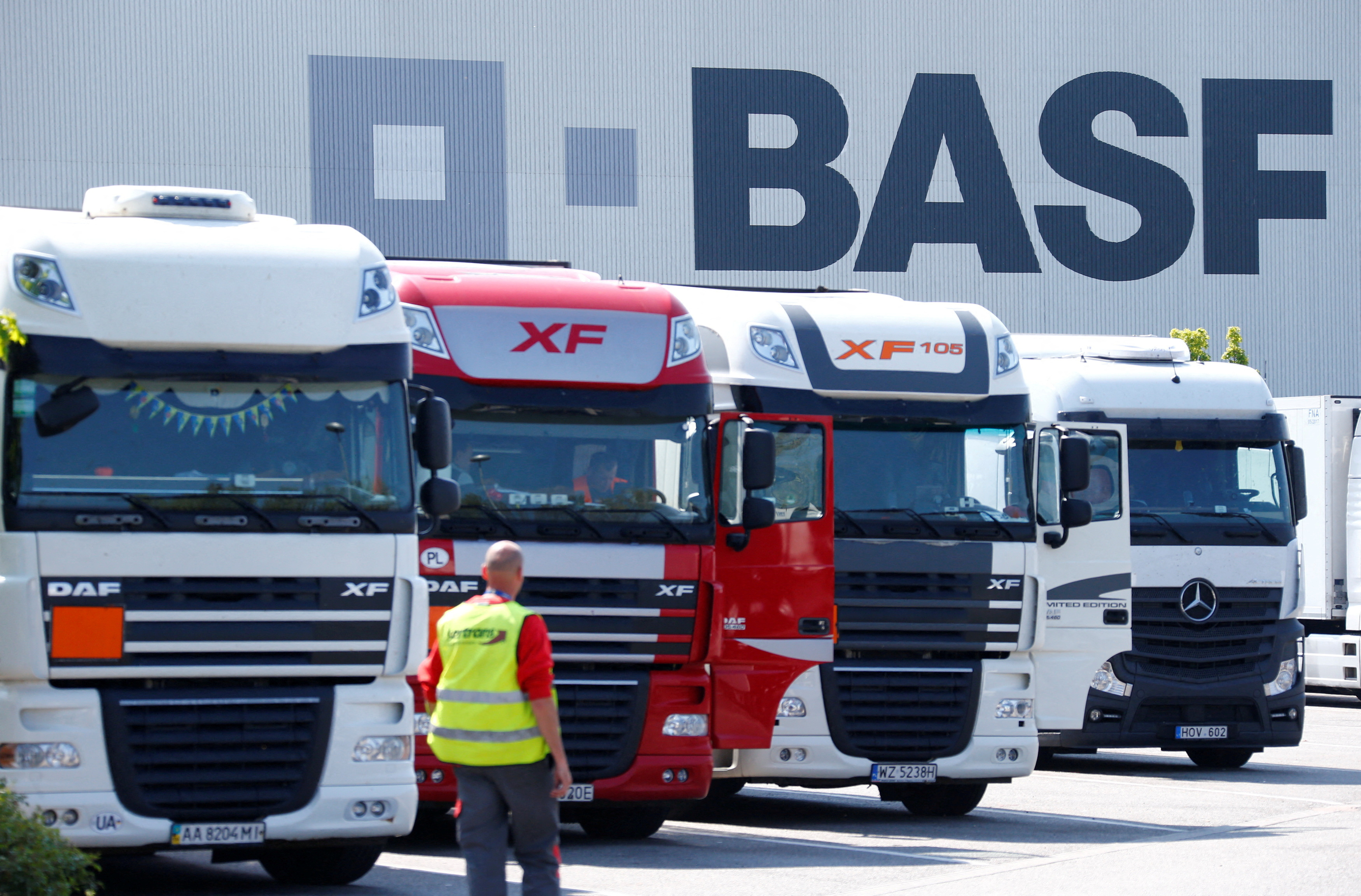 Trucks are parked in front of a warehouse of German chemical company BASF in Ludwigshafen