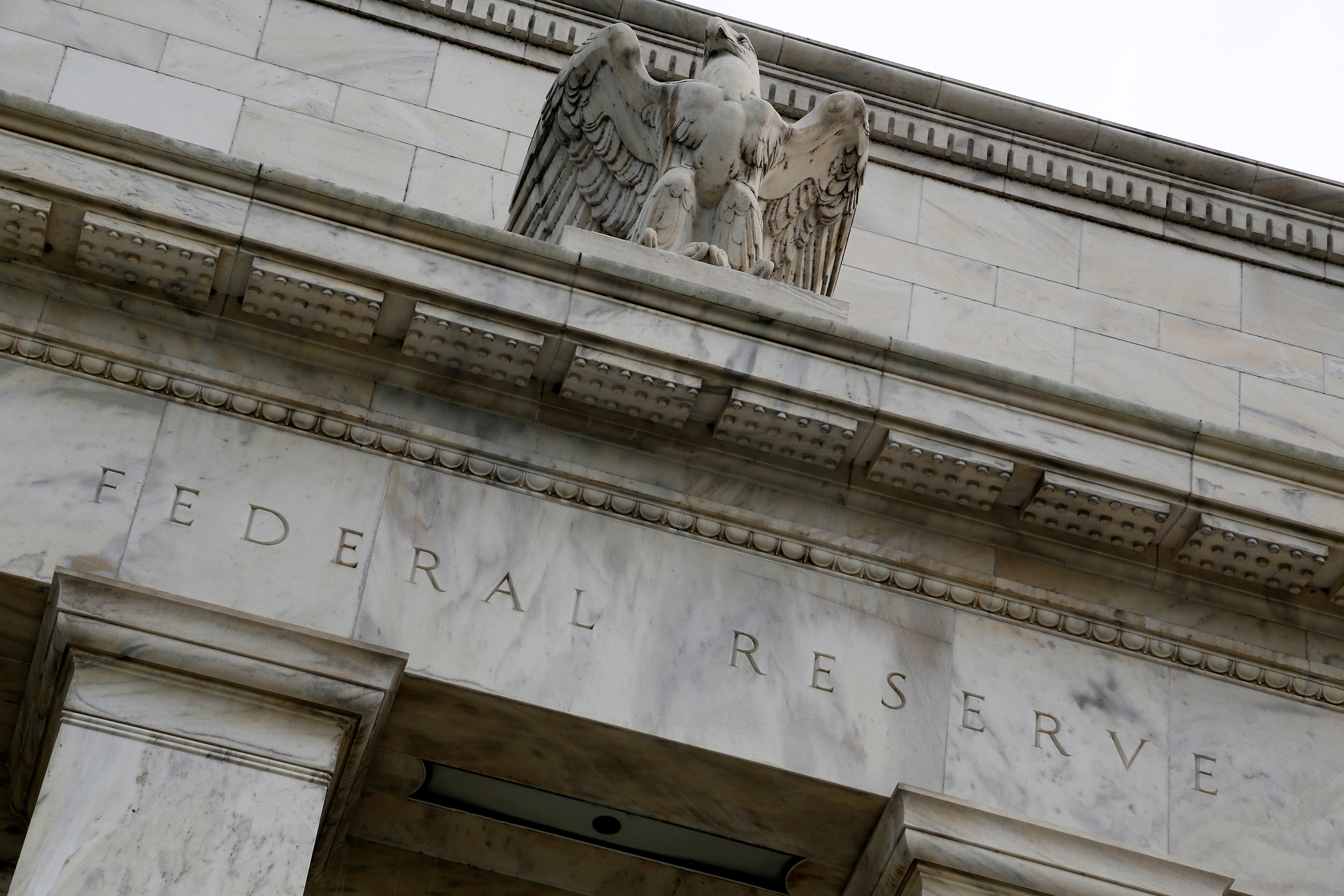 An eagle tops the U.S. Federal Reserve building's facade in Washington, July 31, 2013.  REUTERS/Jonathan Ernst
