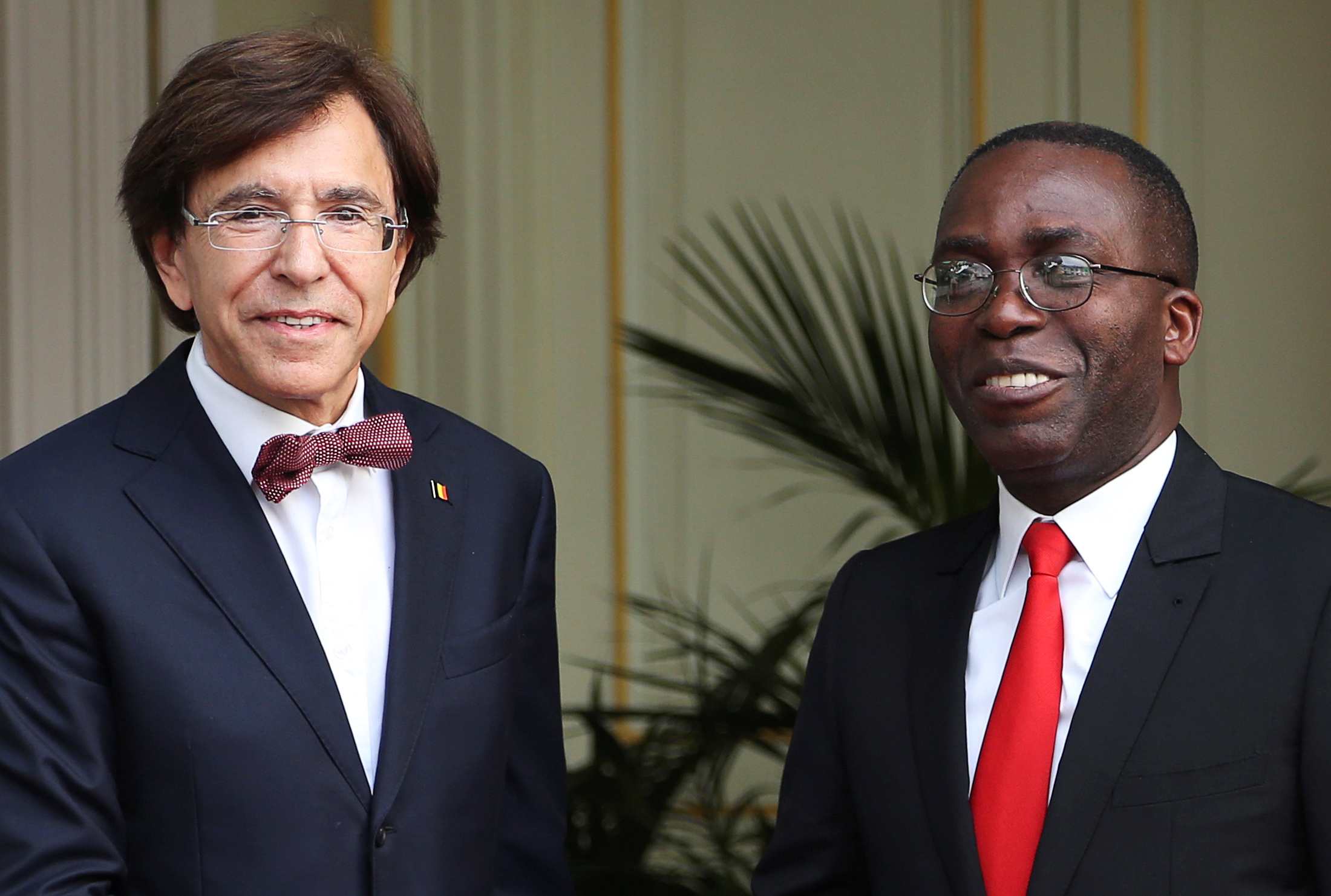 Belgium's PM Di Rupo poses with Democratic Republic of Congo's PM Matata Ponyo ahead of a meeting in Brussels