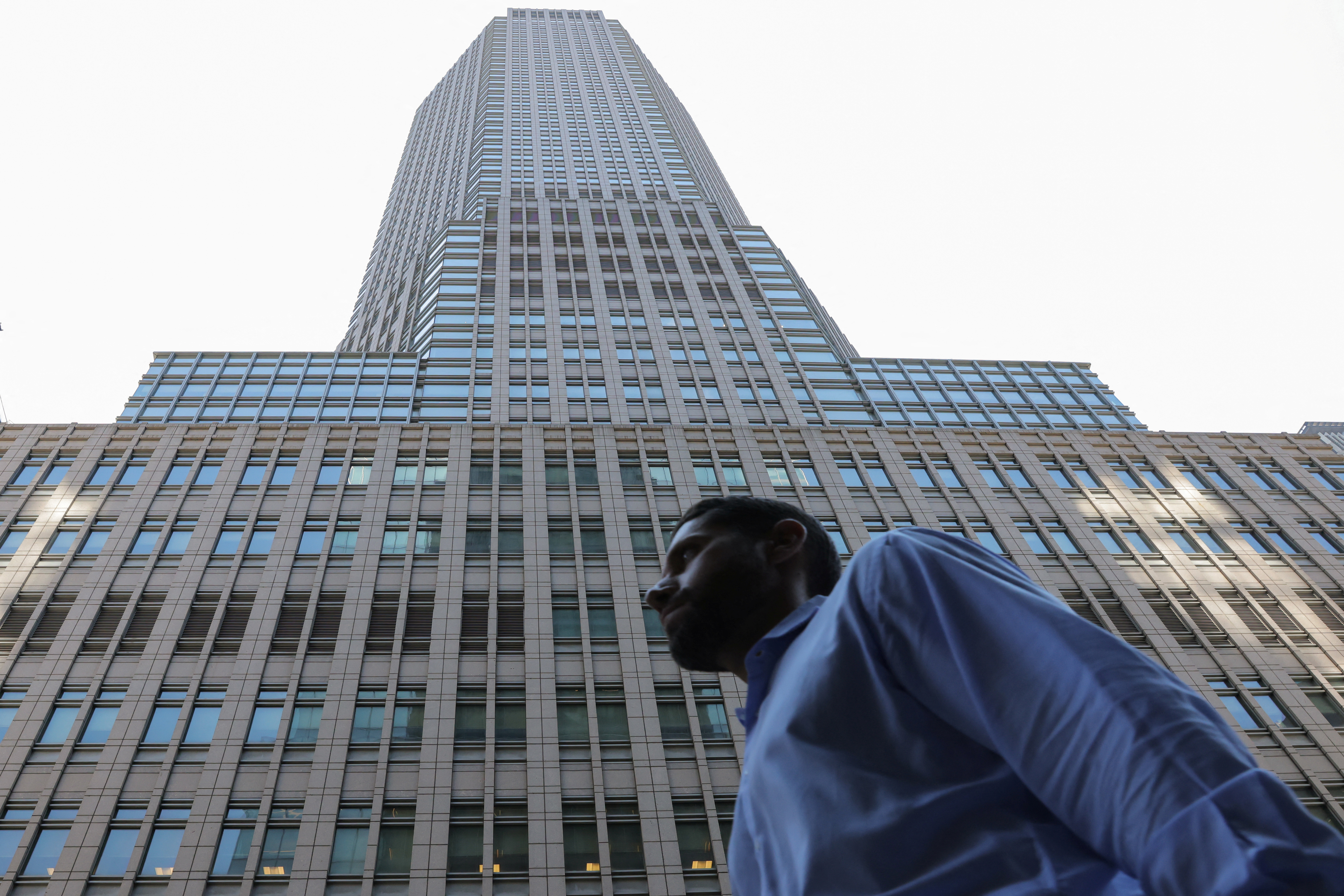 A person walks by the JPMorgan Chase & Co. New York Head Quarters in Manhattan, New York City