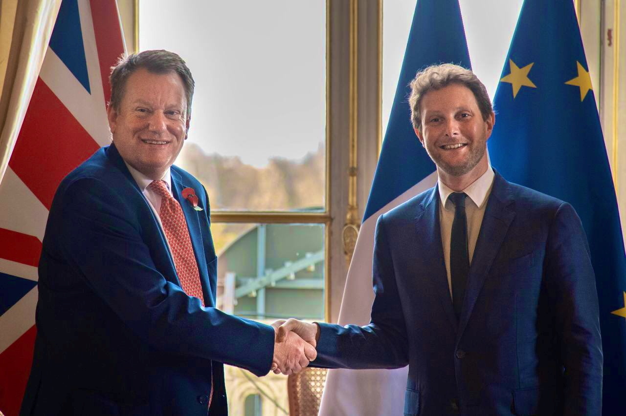 French European Affairs Minister Clement Beaune shakes hands with British Brexit Minister David Frost during their meeting in Paris, France November 4, 2021 in this handout picture obtained from social media. H. Serraz/French Foreign Ministry/Handout via REUTERS