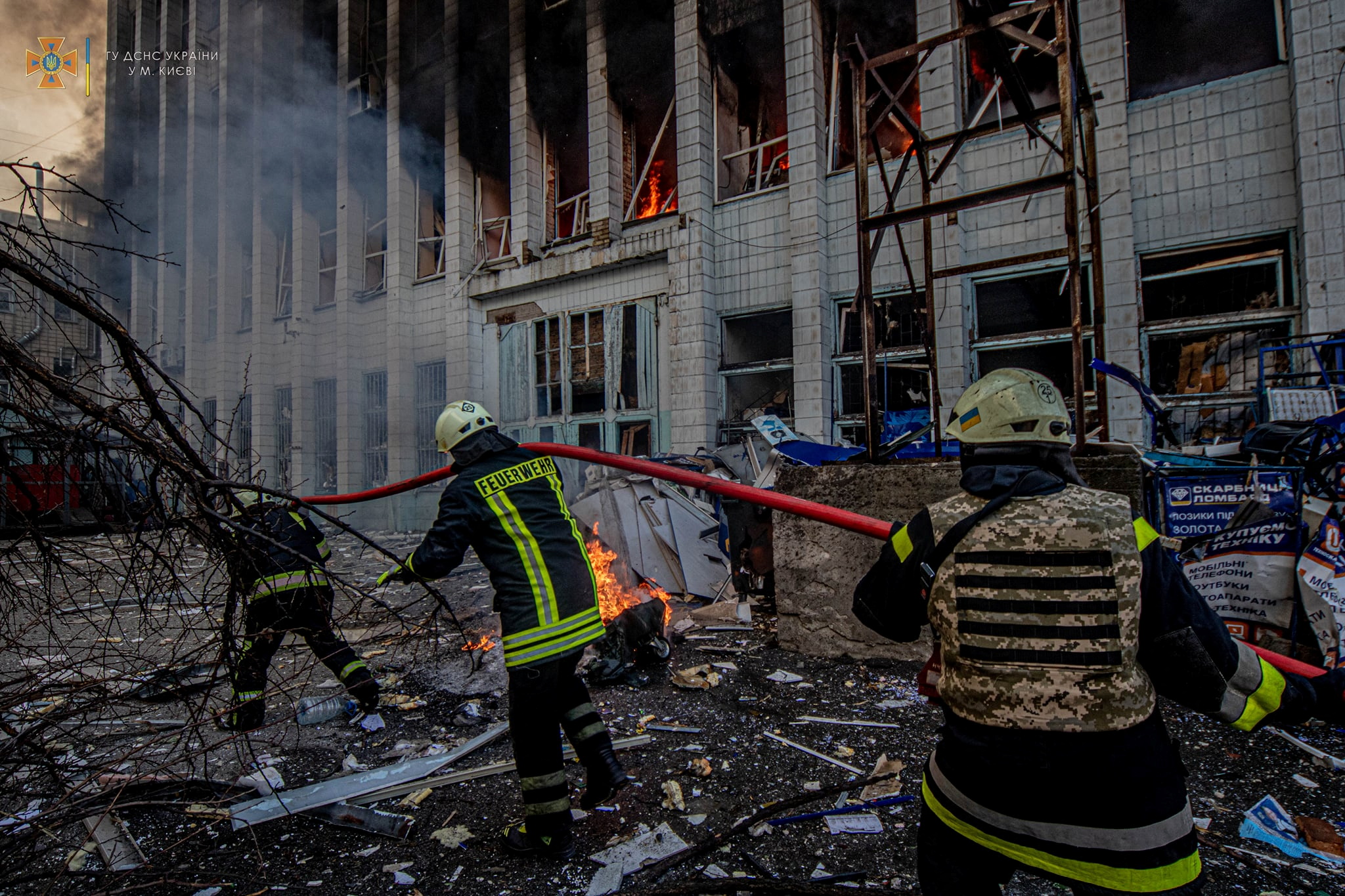 Rescuers work at a site of an industrial building damaged by an airstrike in Kyiv