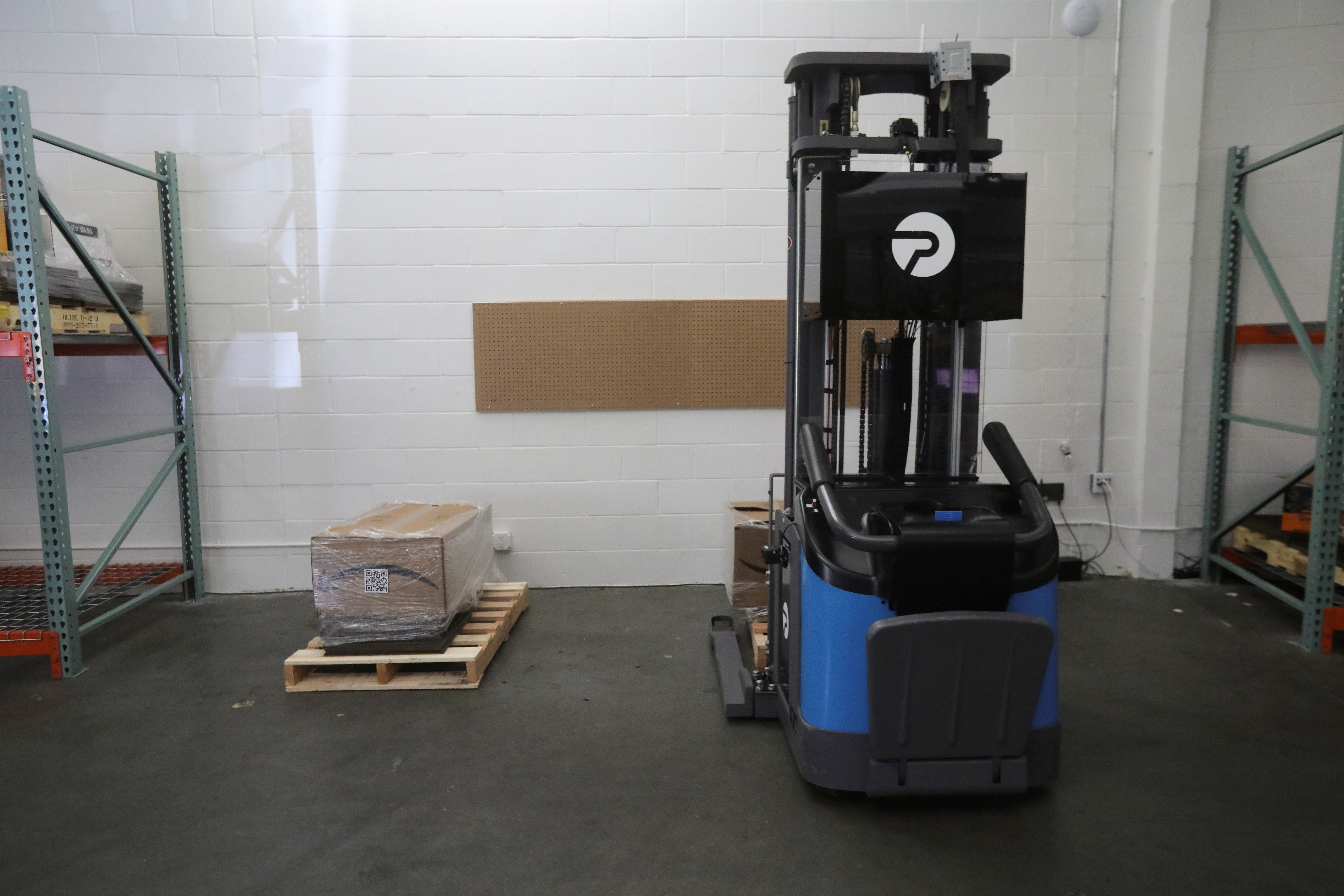 A forklift controlled by a remote operator moves in a warehouse in a demonstration by Phantom Auto in Mountain View